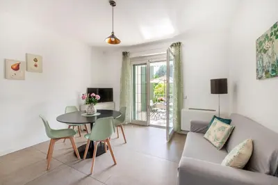 a living room with a table and a couch at Pigneto Terrace - Residenze Romanae in Rome