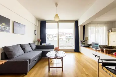 a living room with a couch and a table at Art Loft Penthouse near Trastevere in Rome