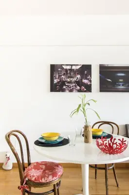 a dining room table with a white table and chairs at Art Loft Penthouse near Trastevere in Rome