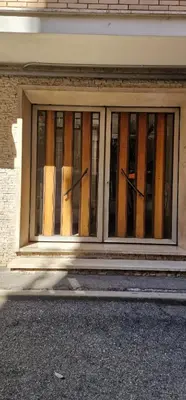 a window of a building with stained glass at Due Calzini in Rome