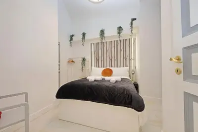 a bedroom with a bed with two stuffed animals on it at Principe Amedeo piano terra in Rome
