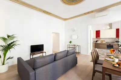a living room with a couch and a table at Quiet retreat in Trastevere - ZENO 45 in Rome