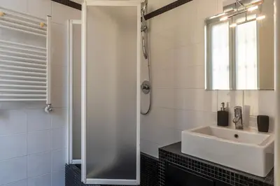 a bathroom with a shower and a sink at Piazza Alessandria - FromHometoRome in Rome