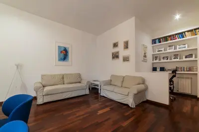a living room with two couches and a table at Piazza Alessandria - FromHometoRome in Rome