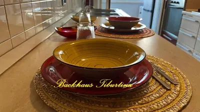 a kitchen counter with three bowls on a table at Backhaus Tiburtina in Rome