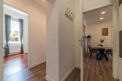 a hallway with a dining room and a table at Casa Matilde - WelcomeToRhome in Rome