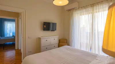 a bedroom with a bed and a tv on the wall at Vatican Park Residence in Rome