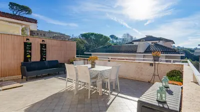a patio with a table and chairs on a balcony at Vatican Park Residence in Rome
