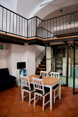 a dining room with a table and two chairs at Loft in Rhome in Rome