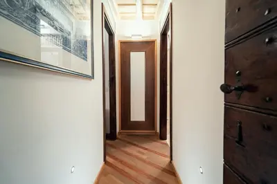an empty hallway with a door and a picture at Majorelle comfy apartment in Rome
