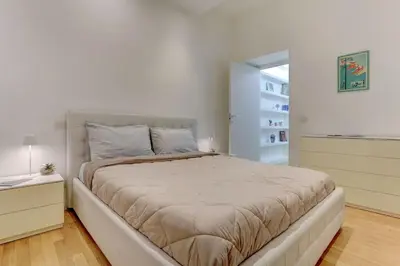 a bedroom with a large bed in a room at Porta Pia Suite in Rome