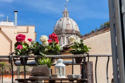 a view of a building with flowers on a balcony at Boutique Domus Navona Librari Balcony in Rome
