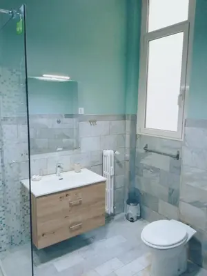 a bathroom with a sink and a toilet and a shower at Domus Remo Room #3 in Rome