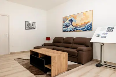 a living room with a couch and a table at Vatican Giuliano’s House in Rome