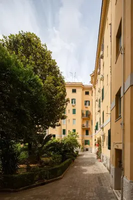 an empty street in a city with buildings at Casa Simone - The Italian Stay Collection in Rome