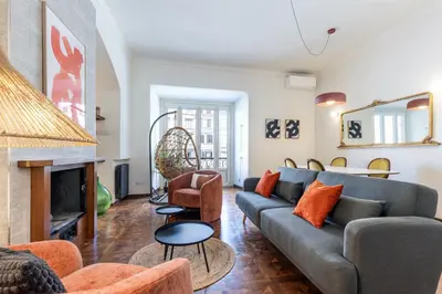a living room with a couch and a fireplace at Rome As You Feel - Argentina Luxury Apartment in Rome