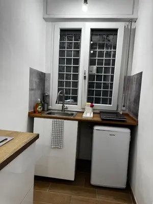 a kitchen with a sink and a window at Olimpia Love Apartament in Rome