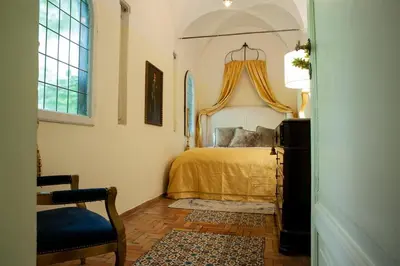 a bathroom with a large white bowl sink on a table at House-Museum Palazzo Podocataro in Rome