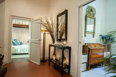 a bedroom with a bed and a potted plant at House-Museum Palazzo Podocataro in Rome