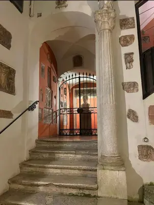 a door to a building with green plants on it at House-Museum Palazzo Podocataro in Rome