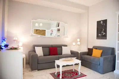 a living room with a couch and a table at Authentic Sweet Home in Rome
