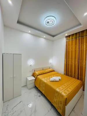 a bedroom with a bed with two towels on it at Acropoli in Rome