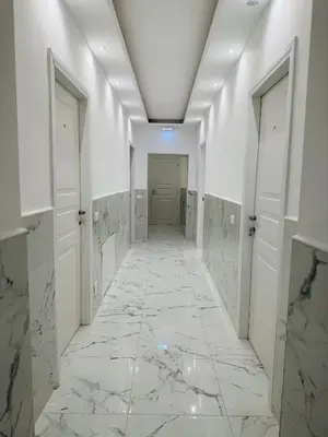 a hallway with marble floors and white walls at Acropoli in Rome