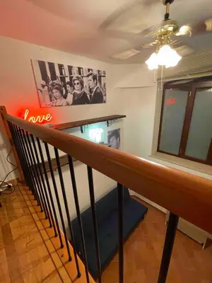 a room with a staircase with a sign that says love at Bnb cuore di Roma in Rome