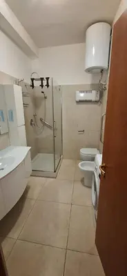 a bathroom with two toilets and a glass shower at IN love with rome gemelli e vaticano in Rome