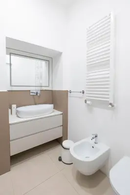 a bathroom with a sink and a tub and a toilet at Stunning 1BR, 2BATH Apartment in the Heart of Rome 6C in Rome