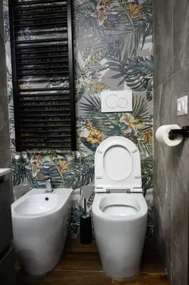 a bathroom with a toilet and a sink at La Dimora del Re in Rome