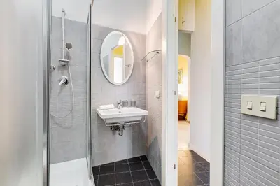 a bathroom with a sink and a mirror at BDC - Kingdom 5-BDR in Termini in Rome
