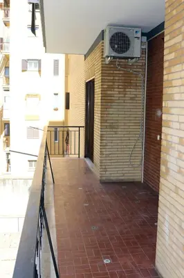 a balcony with a heater on the side of a building at Luca's House - Your perfect Roman hideaway in Rome