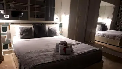 a bedroom with a large bed with a gift on it at Piazza di Spagna, ground floor, historic center in Rome