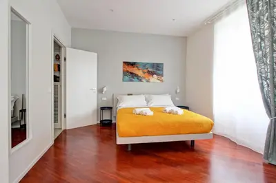 a bedroom with a bed with two towels on it at Apartmentdigioia in Rome