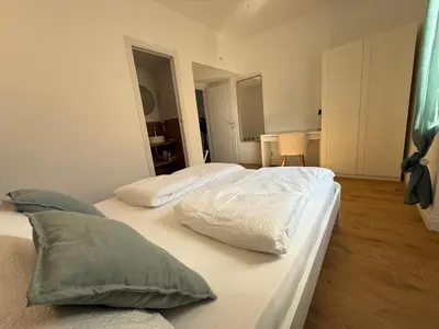 two white beds in a room with at Aurelia Luxury Rome in Rome