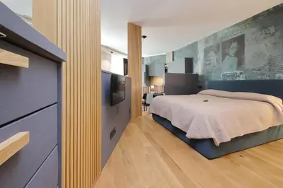 a bedroom with a bed and a television in it at Onofrio in Rome