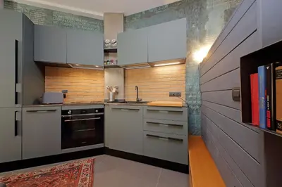 a kitchen with white cabinets and a sink at Onofrio in Rome