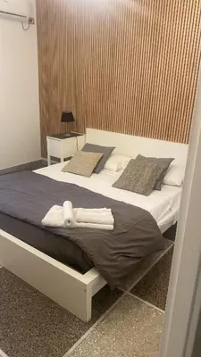 a bed with towels on it in a room at A Casa Di Giallo B&B in Rome