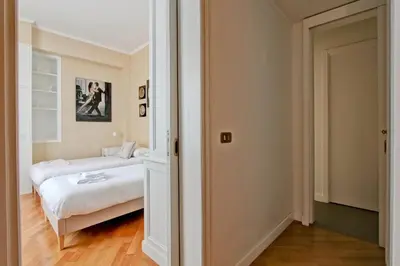 a bedroom with a bed and a bedroom backdoor at Roberta Apartment Fontana di Trevi in Rome