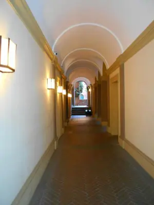 an empty hallway in a building with an arcade at Roberta Apartment Fontana di Trevi in Rome