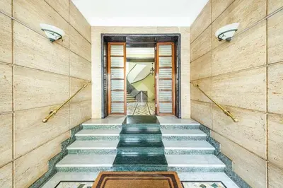 a hallway with stone floors and wooden walls at Your window on San Pietro in Rome
