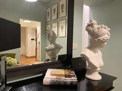 a bust of a woman in front of a mirror at Banchi Vecchi Stay Rooms in Rome
