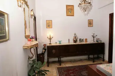 a bathroom with a tub in a room with a mirror at Ipanema B&B in Rome