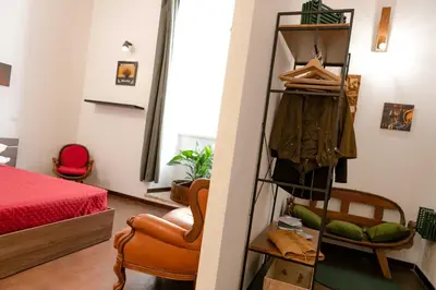 a room with a bed and a closet at ColosseoHome in Rome