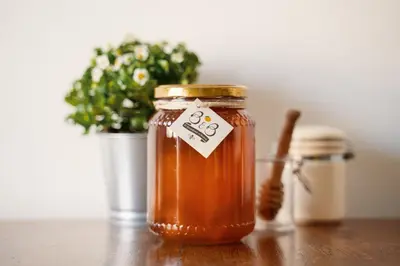 a jar of honey on a table with a plant at B&B Il Giardino di Gabri in Rome