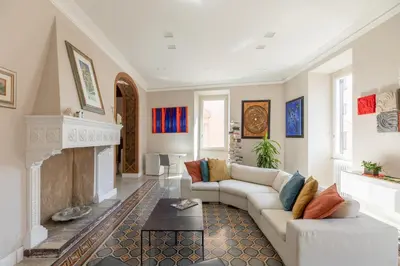 a living room with a couch and a fireplace at iFlat Timeless Elegance in the Center of Rome in Rome