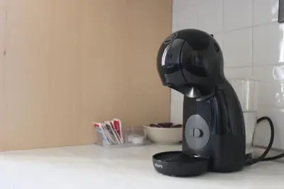 a black mixer sitting on top of a kitchen counter at Relais Monteverde in Rome