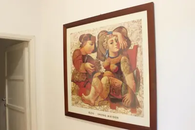 a painting of two women sitting on a wall at Relais Monteverde in Rome