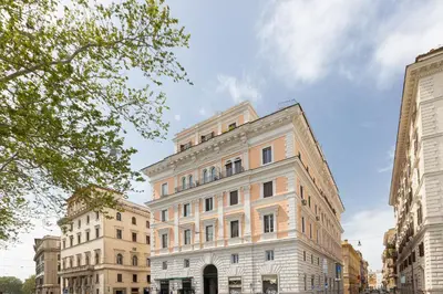 a large white building in the middle of buildings at Mellini View by Rental in Rome in Rome